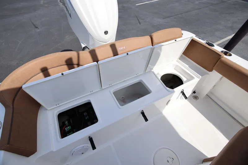 Slide: The Image of 2022 Sea Hunt Ultra 239 SE boat interior with open storage compartments. - 7