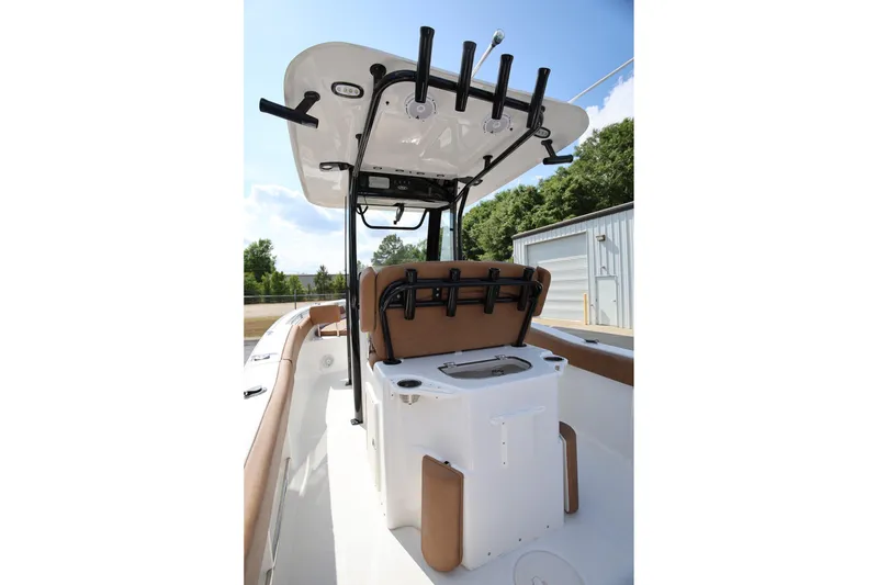 Slide: The Image of 2022 Sea Hunt Ultra 239 SE boat interior with rod holders and seating. - 8