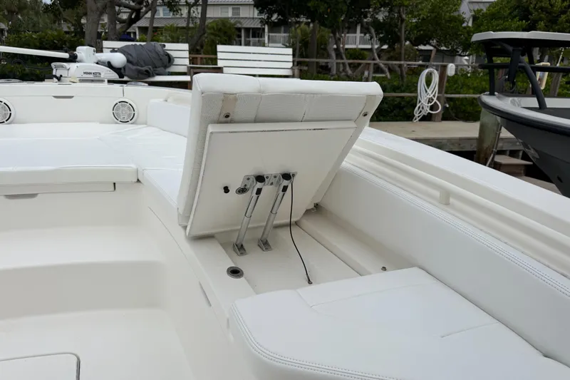 Slide: The Image of 2019 Regulator 26XO boat interior with adjustable seating and white upholstery. - 10