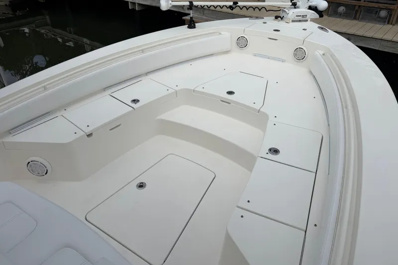 Slide: The Image of 2019 Regulator 26XO boat deck with storage compartments and seating. - 21