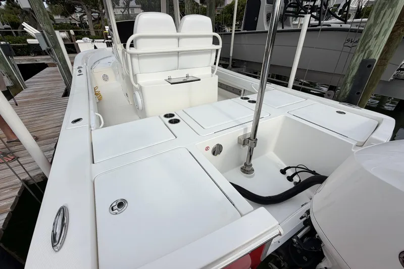Slide: The Image of 2019 Regulator 26XO boat interior with seating and storage compartments. - 38