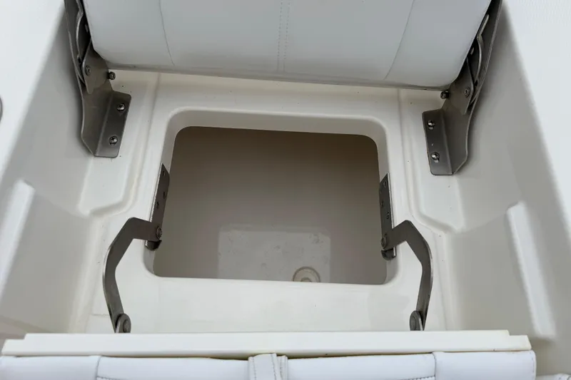 Slide: The Image of Open storage compartment on a 2019 Regulator 26XO boat. - 40