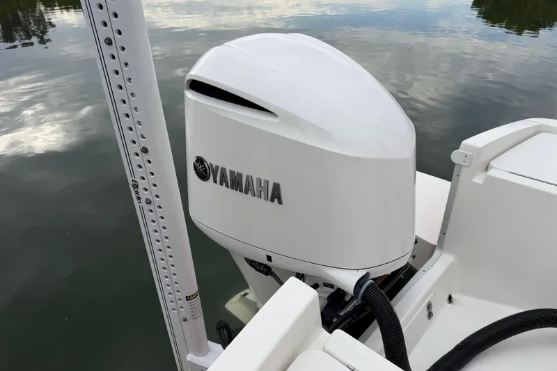 Slide: The Image of 2019 Regulator 26XO boat with Yamaha outboard motor on calm water. - 45