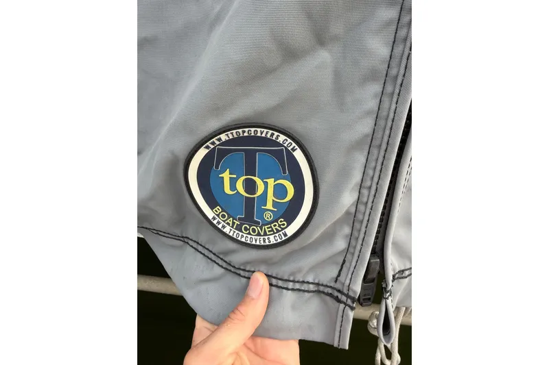 Slide: The Image of Gray boat cover with T-Top Boat Covers logo, suitable for 2019 Regulator 26XO. - 51