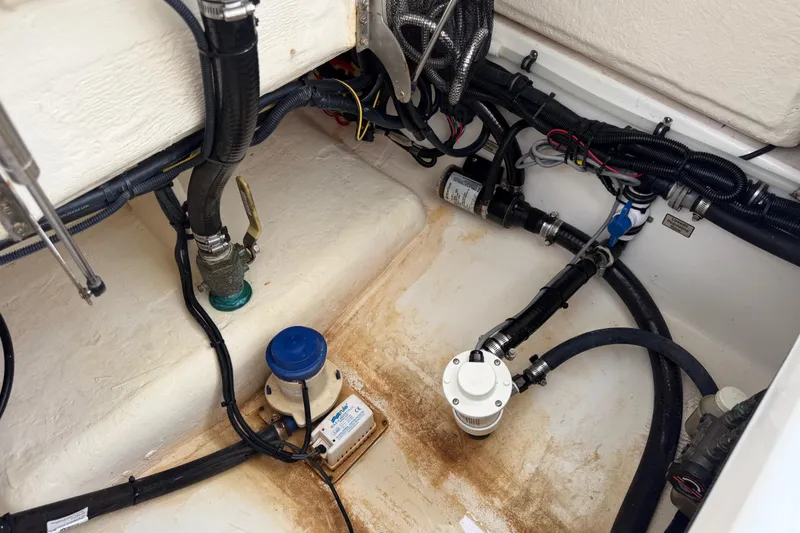 Slide: The Image of 2019 Regulator 26XO boat bilge area with hoses and fittings. - 53