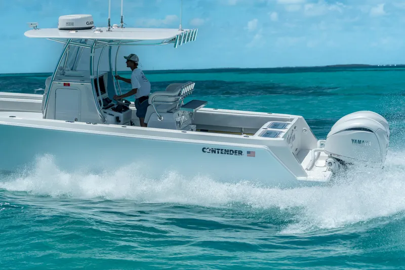 Slide: The Image of 2026 Contender 32 ST boat cruising on turquoise ocean waters. - 5