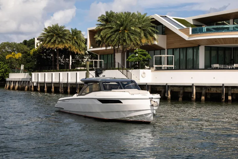 The Image of Luxury Santasevera 42 yacht cruising near modern waterfront home, 2026 model. - 0