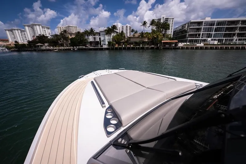 Slide: The Image of Luxurious Santasevera 42 yacht cruising near waterfront buildings, 2026 model. - 2