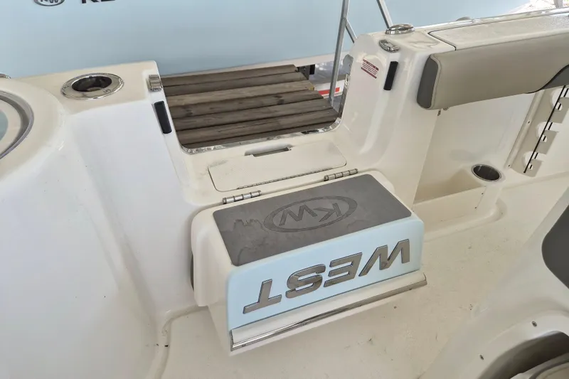 Slide: The Image of 2026 Key West 260 Center Console boat interior with seating and storage features. - 11