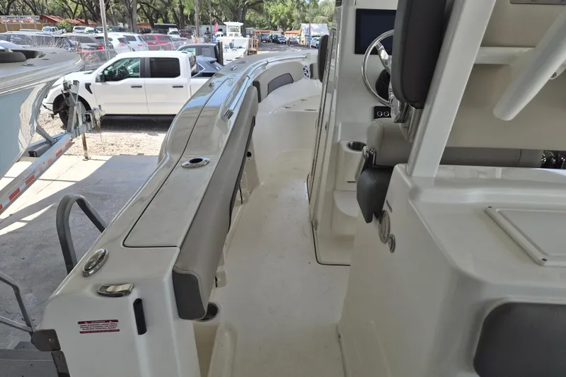 Slide: The Image of 2026 Key West 260 Center Console boat interior with seating and steering wheel. - 12