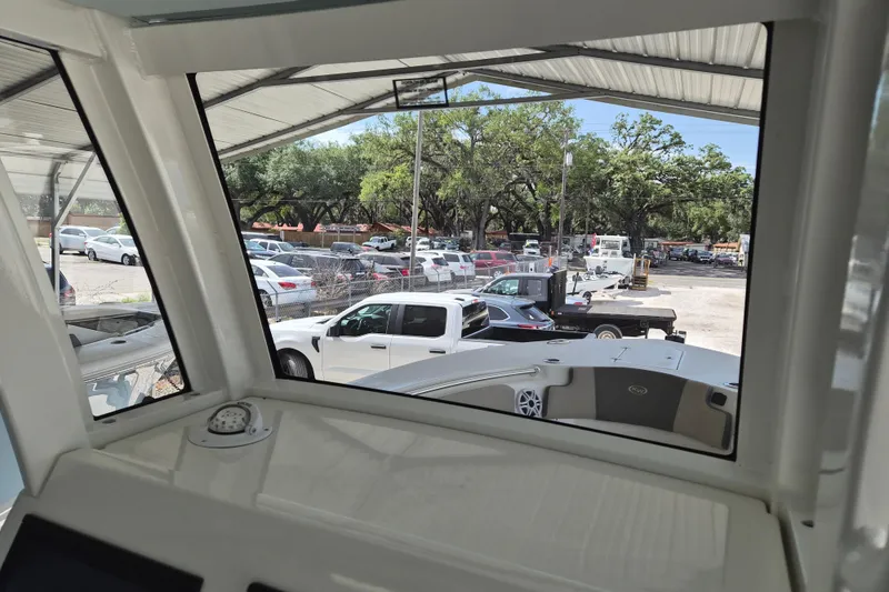 Slide: The Image of Interior view from 2026 Key West 260 Center Console boat, overlooking parking lot. - 15