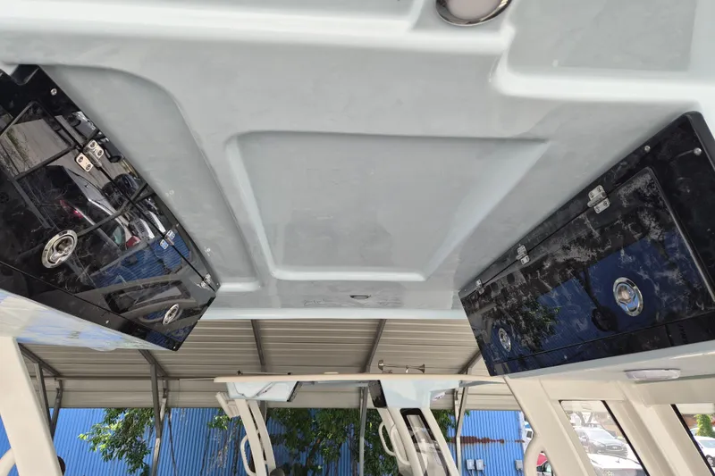 Slide: The Image of 2026 Key West 260 Center Console boat interior with overhead storage compartments. - 16