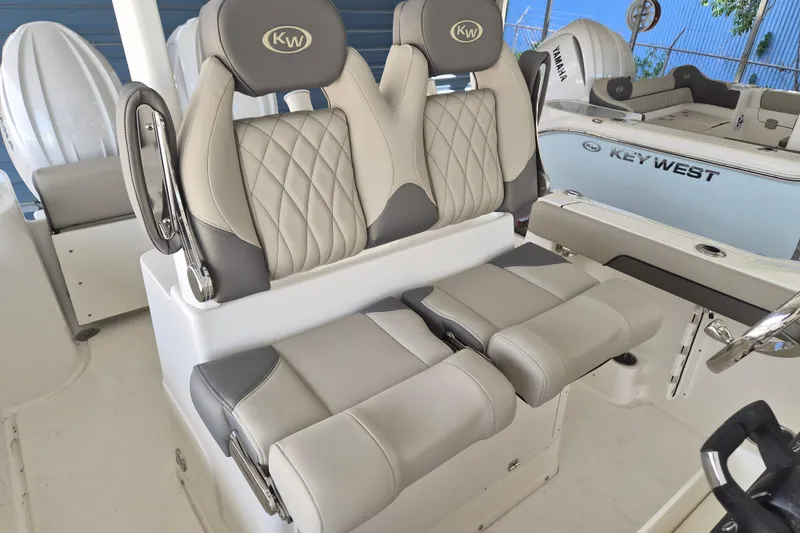 Slide: The Image of 2026 Key West 260 Center Console boat with luxurious seating and modern design. - 17