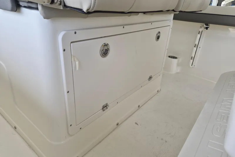 Slide: The Image of 2026 Key West 260 Center Console boat interior storage compartment. - 18
