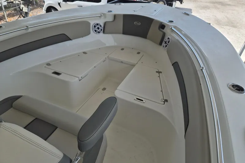 Slide: The Image of 2026 Key West 260 Center Console boat interior with seating and storage compartments. - 19