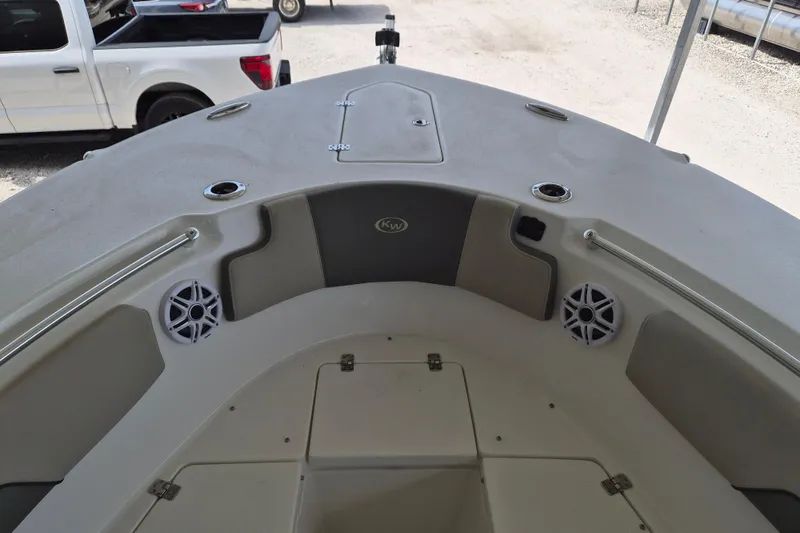 Slide: The Image of 2026 Key West 260 Center Console boat interior with speakers and storage compartments. - 23