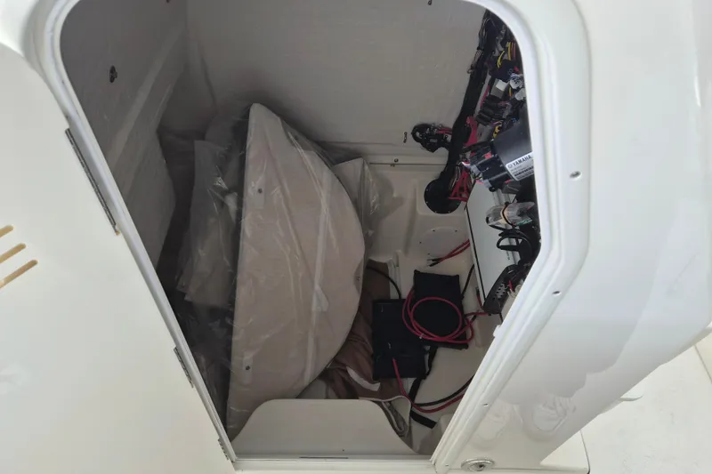 Slide: The Image of Interior view of 2026 Key West 260 Center Console boat compartment with wiring and equipment. - 27