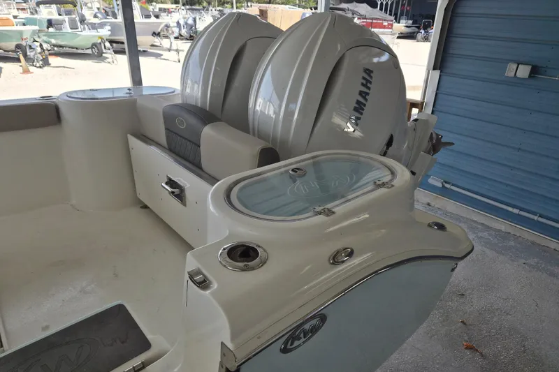 Slide: The Image of 2026 Key West 260 Center Console boat with Yamaha engines in a showroom. - 3