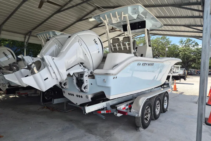 Slide: The Image of 2026 Key West 260 Center Console boat on trailer under shelter. - 5