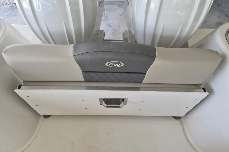 Slide: The Image of 2026 Key West 260 Center Console boat seat with storage compartment. - 7