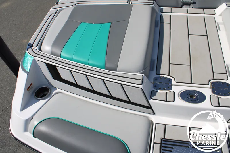 Slide: The Image of Malibu Wakesetter 23 MXZ 2020 boat rear with gray and teal upholstery. - 10