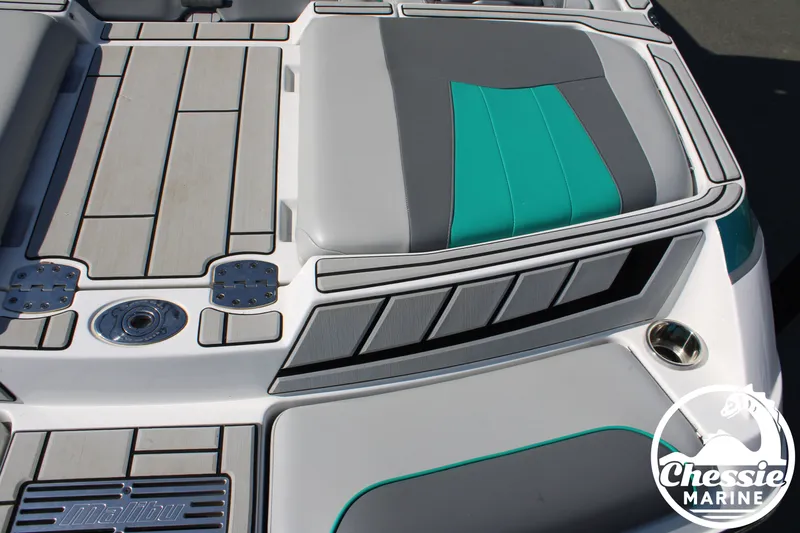 Slide: The Image of Malibu Wakesetter 23 MXZ 2020 boat rear with gray and teal upholstery. - 11