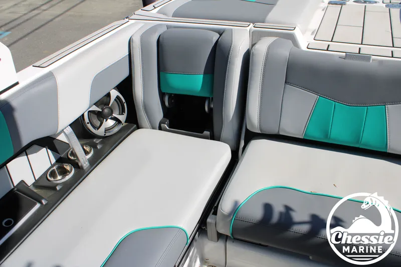 Slide: The Image of Interior of 2020 Malibu Wakesetter 23 MXZ with gray and teal seating. - 14