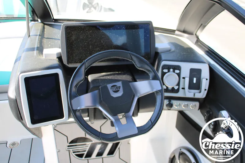 Slide: The Image of 2020 Malibu Wakesetter 23 MXZ steering console with modern controls. - 19