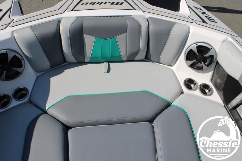 Slide: The Image of Interior of 2020 Malibu Wakesetter 23 MXZ with gray and green seating. - 23