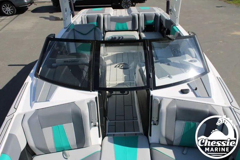 Slide: The Image of 2020 Malibu Wakesetter 23 MXZ boat with sleek design and gray seating. - 24