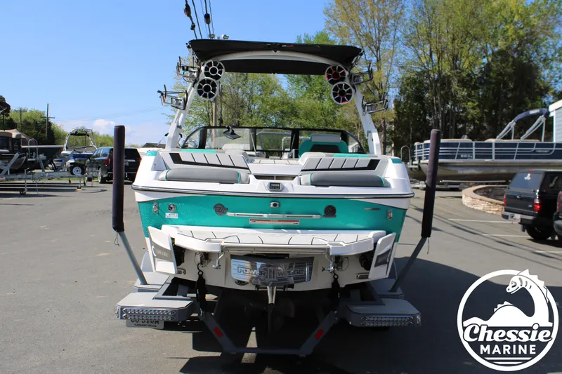 Slide: The Image of Rear view of a 2020 Malibu Wakesetter 23 MXZ boat in a parking lot. - 4