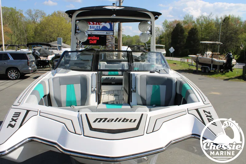 Slide: The Image of 2020 Malibu Wakesetter 23 MXZ boat in parking lot. - 8