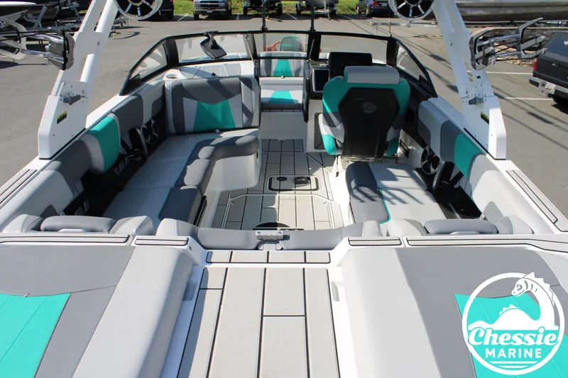 Slide: The Image of Interior of 2020 Malibu Wakesetter 23 MXZ with gray and teal seating. - 9