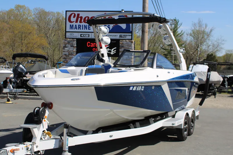 The Image of 2018 Malibu Wakesetter 23 LSV on trailer at marine dealership. - 1