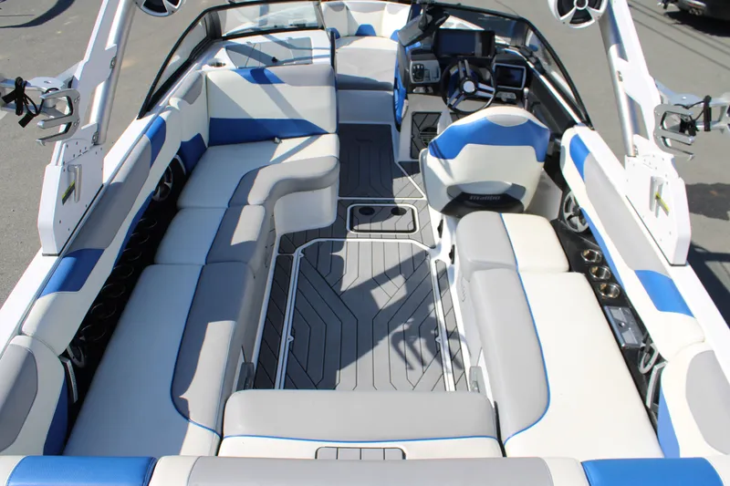 Slide: The Image of Interior of 2018 Malibu Wakesetter 23 LSV boat with blue and gray seating. - 11