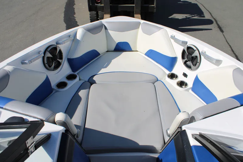 Slide: The Image of 2018 Malibu Wakesetter 23 LSV boat interior with blue and white seating. - 12