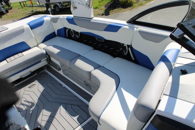 Slide: The Image of Interior of 2018 Malibu Wakesetter 23 LSV with blue and gray seating. - 14