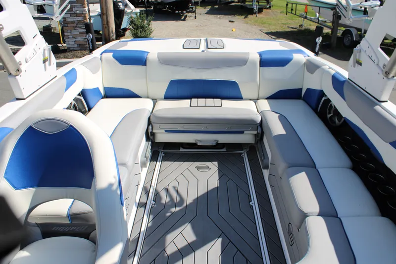 Slide: The Image of Interior of 2018 Malibu Wakesetter 23 LSV with blue and gray seating. - 15