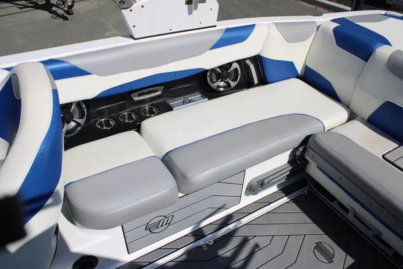 Slide: The Image of Interior of 2018 Malibu Wakesetter 23 LSV with blue and gray seating. - 16