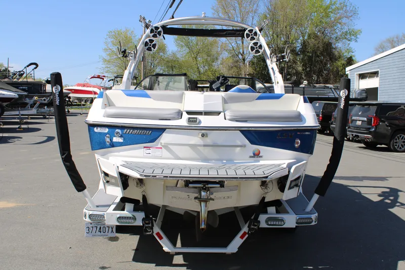 Slide: The Image of Rear view of a 2018 Malibu Wakesetter 23 LSV boat in a parking lot. - 4