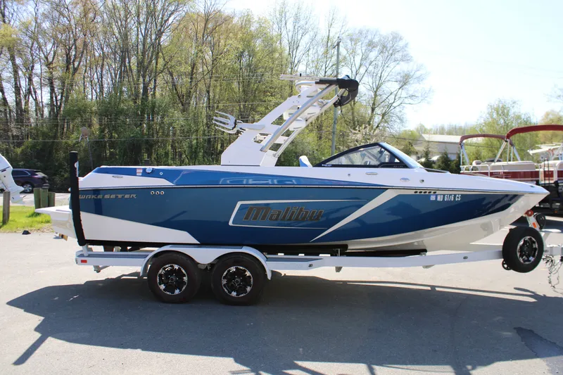 Slide: The Image of 2018 Malibu Wakesetter 23 LSV boat on trailer outdoors. - 6