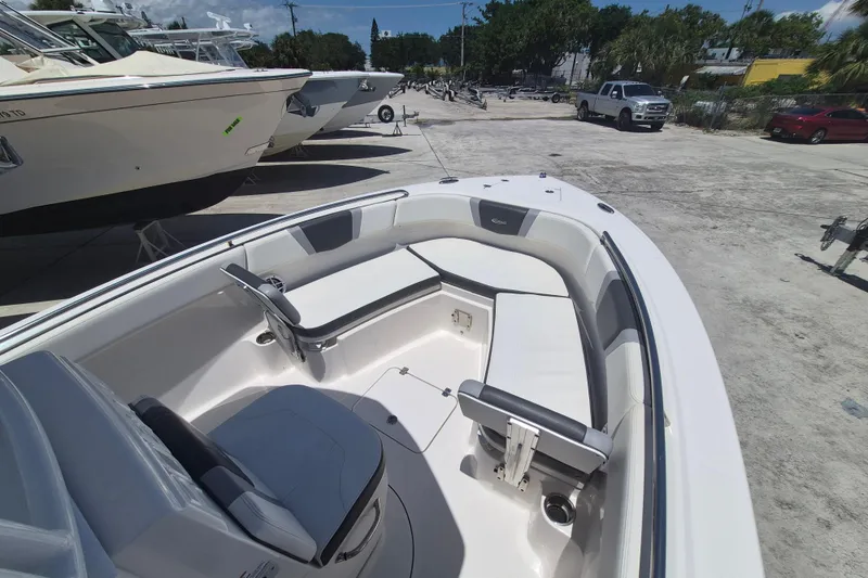 Slide: The Image of 2023 Robalo R230 Center Console boat with spacious seating and sleek design. - 16