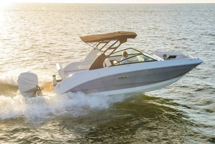 Slide: The Image of Manufacturer Provided Image: 2019 Sea Ray SDX 250 Outboard cruising on open water at sunset. - 16