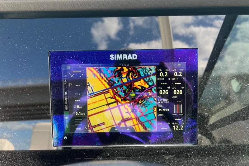 Slide: The Image of Simrad navigation display on 2019 Sea Ray SDX 250 Outboard, showing colorful map and data. - 5