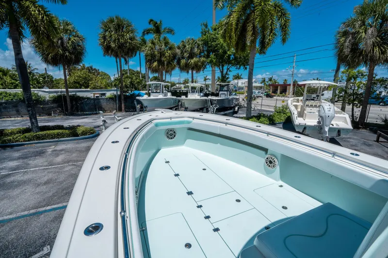 Slide: The Image of 2020 Andros 32 Offshore boat on parking lot with palm trees. - 20