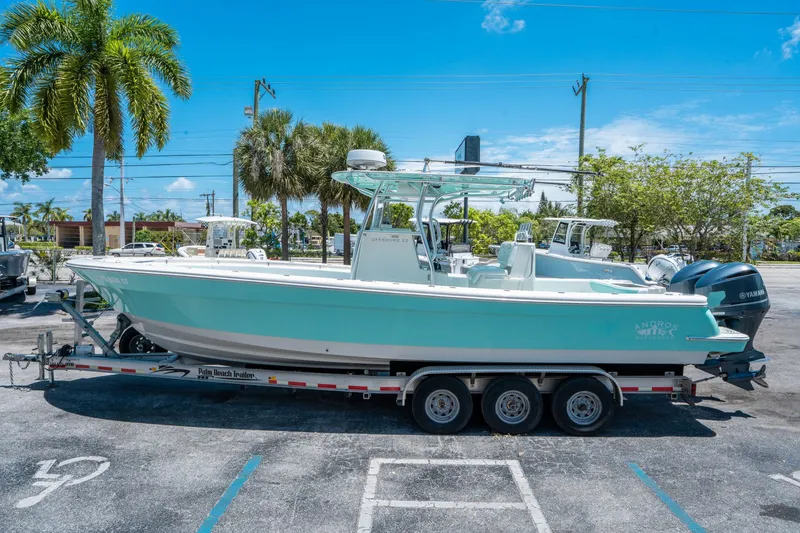 Slide: The Image of 2020 Andros 32 Offshore boat parked on trailer outdoors. - 5