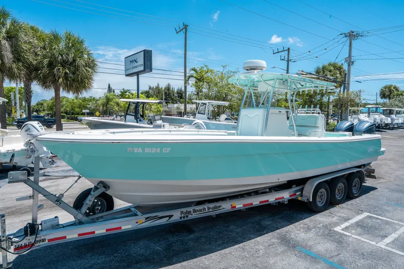 Slide: The Image of 2020 Andros 32 Offshore boat on trailer outdoors. - 6
