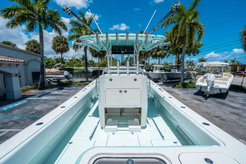 Slide: The Image of 2020 Andros 32 Offshore boat in sunny parking lot with palm trees. - 9
