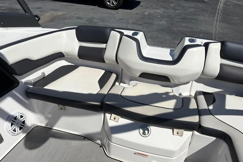 Slide: The Image of 2021 Yamaha Boats AR195 interior seating with black and white upholstery. - 13