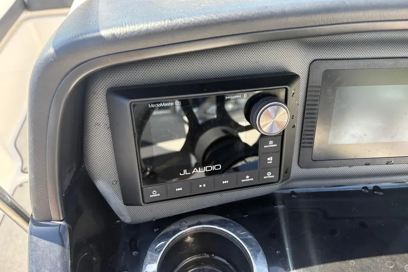 Slide: The Image of Dashboard of a 2021 Yamaha AR195 boat featuring a JL Audio MediaMaster control panel. - 18